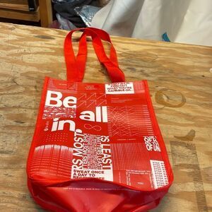 Lululemon Athletica woman’s red small shopping bag